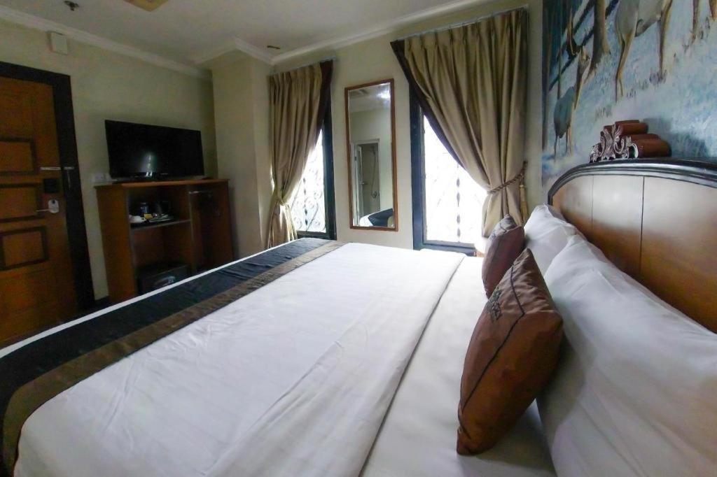 ג'קרטה Amos Cozy Hotel Melawai מראה חיצוני תמונה